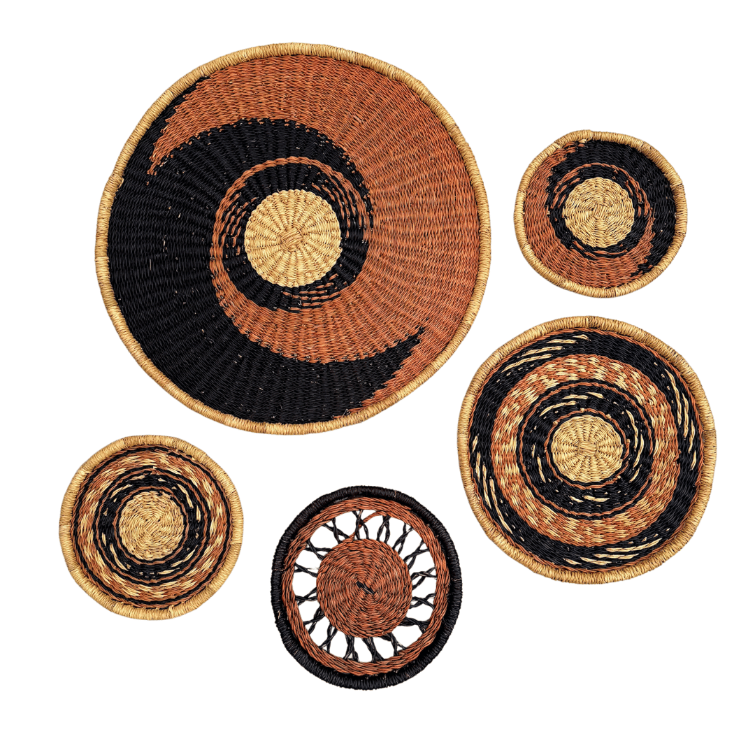 Set of woven baskets with concentric circle patterns on a white background