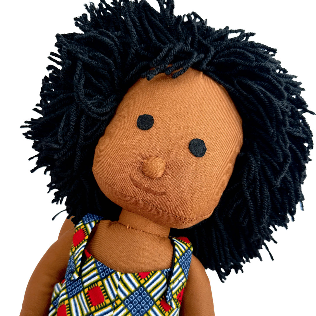 handmade African doll with curly textured hair and Ankara dress
