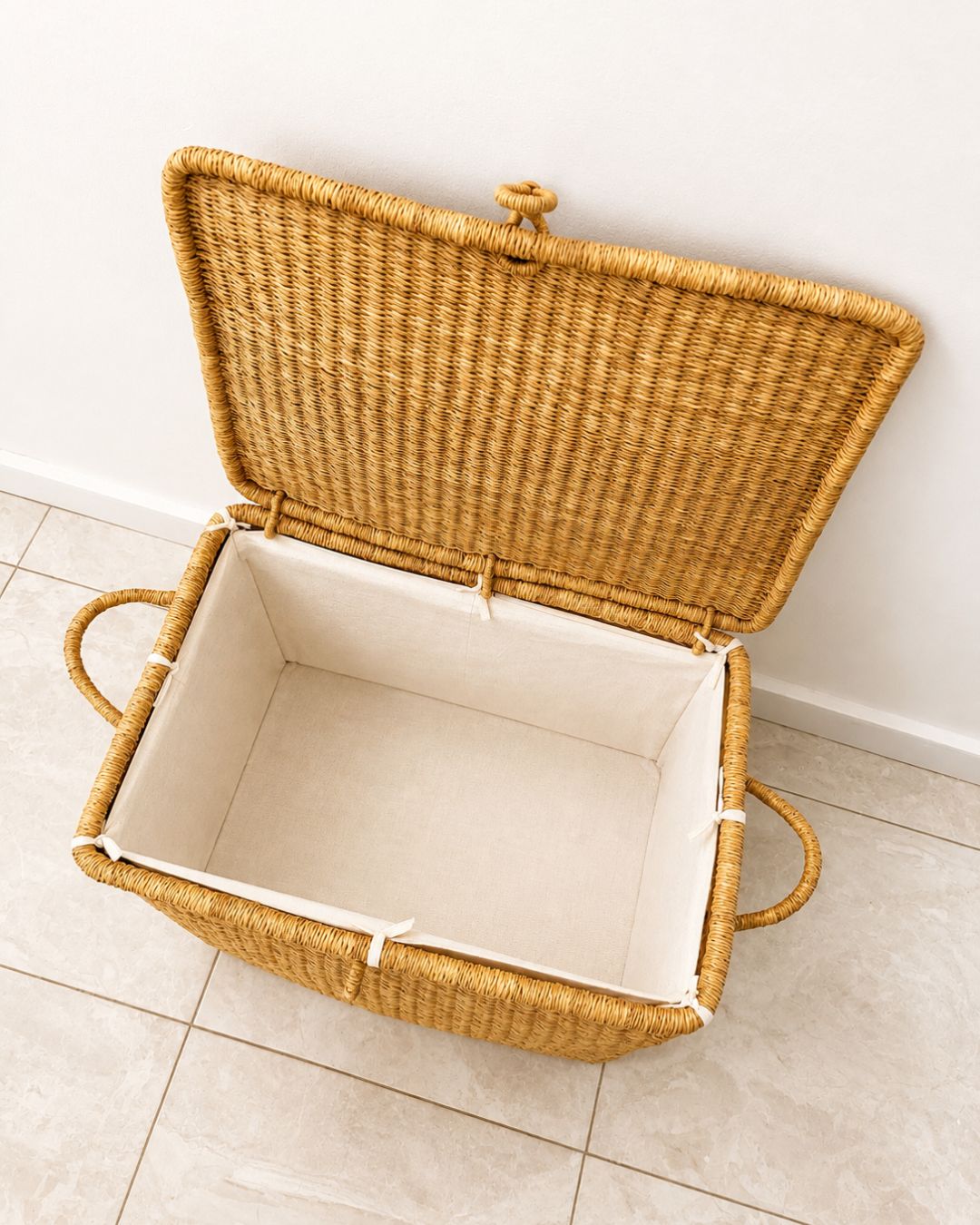 Natural woven picnic basket with fitted lid and fabric lining