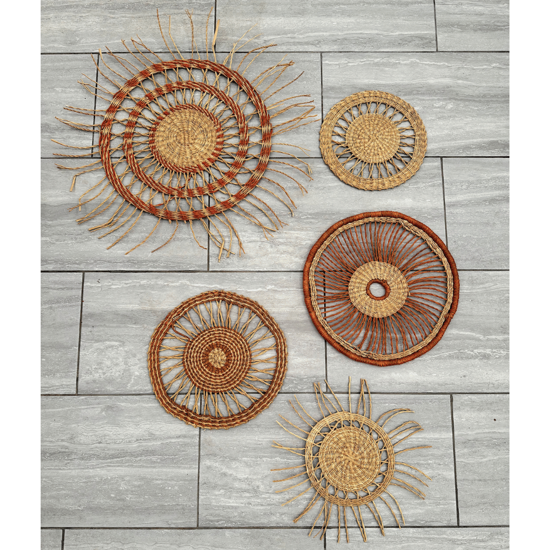 Set of woven wall art pieces on a wooden surface