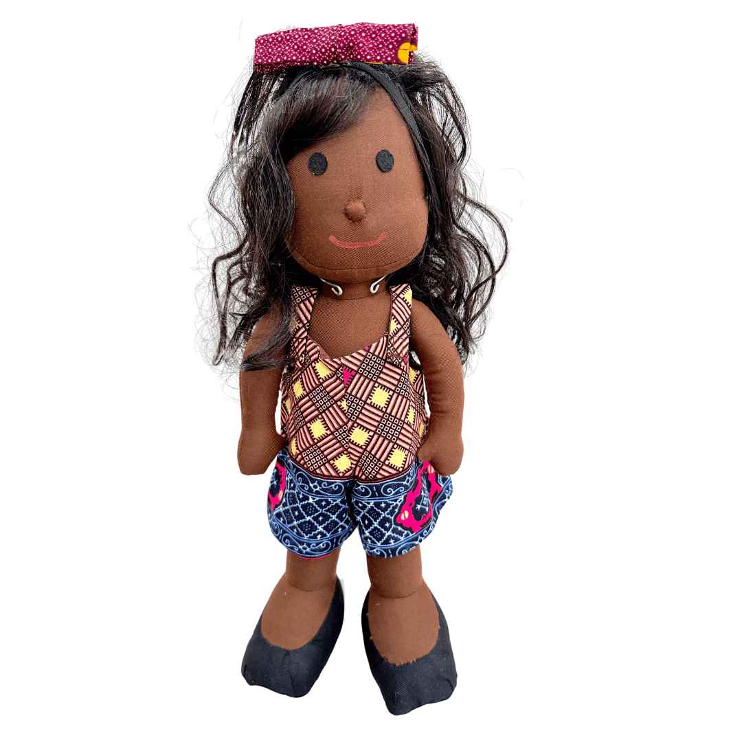 Black doll with patterned top and shorts and black curly hair
