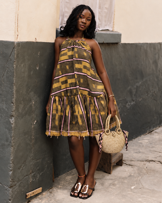 Model carrying the handwoven straw handbag