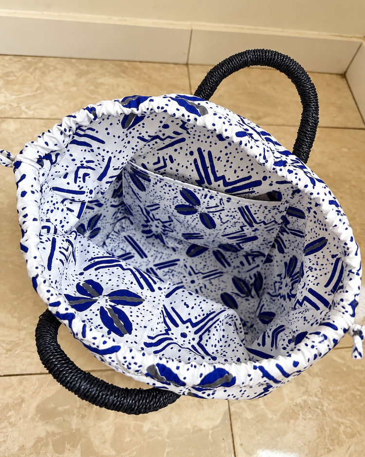 Drawstring lining open inside the straw handbag