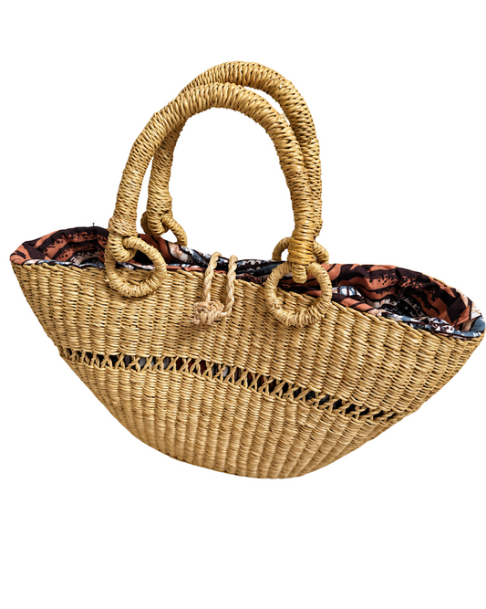 Angled front view of the handwoven straw handbag
