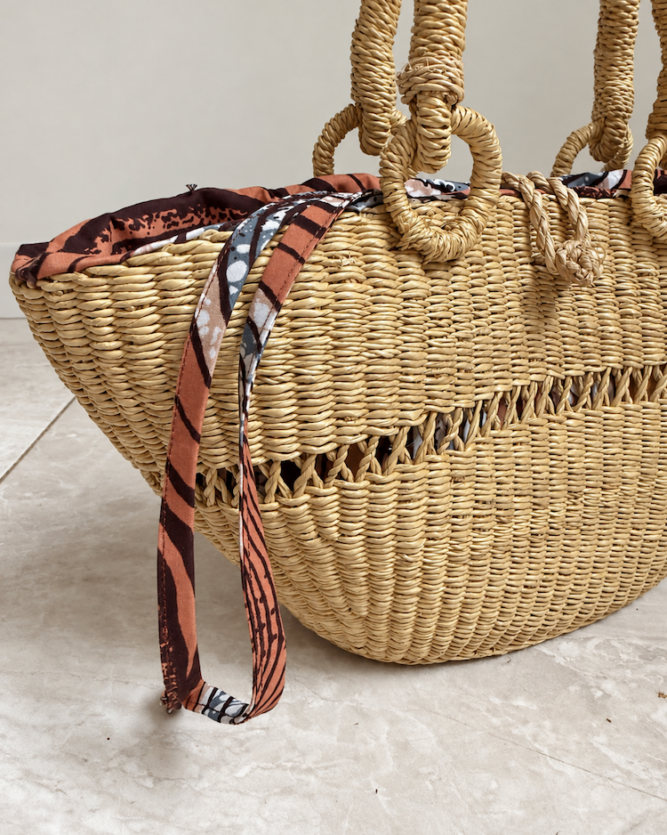 Close-up of the straw weave on the side of the handbag