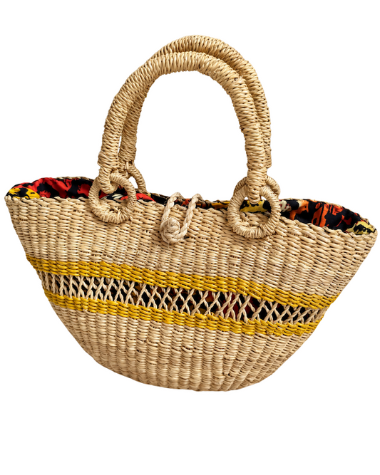 Angled front view of the handwoven straw handbag
