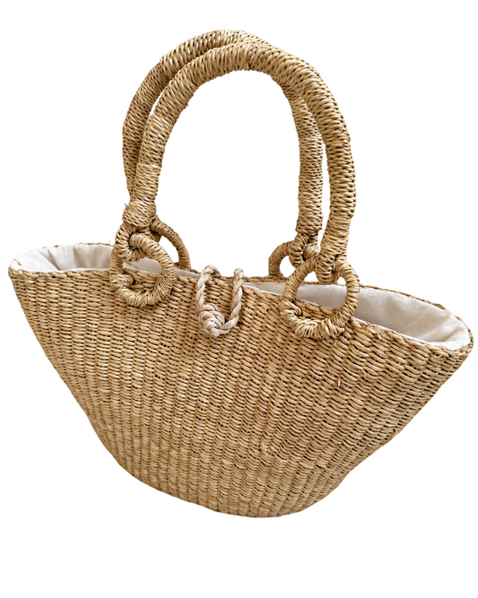 Angled front view of the handwoven raffia handbag
