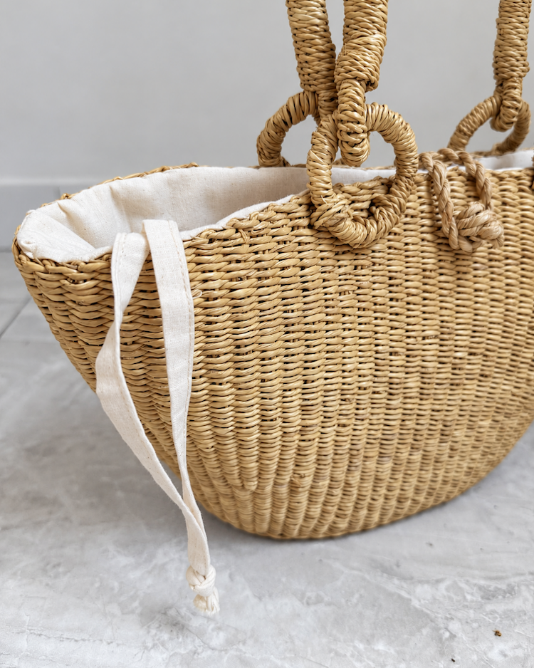 Close-up of the straw weave on the side of the handbag