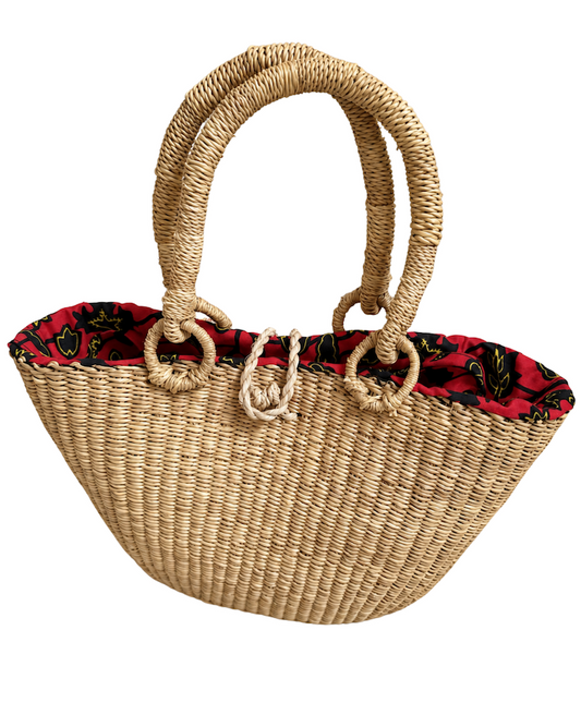 Angled front view of the handwoven raffia handbag